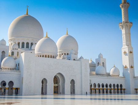 Sheikh Zayed Grand Mosque in Abu Dhabi, United Arab Emirates. One of largest mosques in the world. White marble domes and columnsの写真素材
