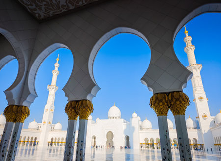 Sheikh Zayed Grand Mosque in Abu Dhabi, United Arab Emirates. One of largest mosques in the world. White marble domes and columnsの写真素材