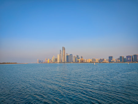 View of Abu Dhabi skyline in the distance during a sunset from Abu Dhabi marina sideの写真素材