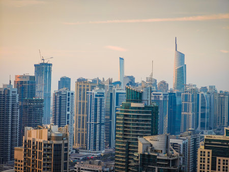 12 02 2025 - Dubai, UAE. Dubai Marina during a sunrise. Aerial drone view of Dubai skyline, urban waterfront. Dubai panoramic sunset backgroundのeditorial素材