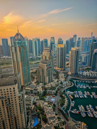 12 02 2025 - Dubai, UAE. Dubai Marina during a sunrise. Aerial drone view of Dubai skyline, urban waterfront. Dubai panoramic sunset backgroundのeditorial素材
