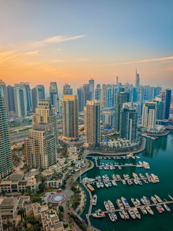 12 02 2025 - Dubai, UAE. Dubai Marina during a sunrise. Aerial drone view of Dubai skyline, urban waterfront. Dubai panoramic sunset backgroundのeditorial素材