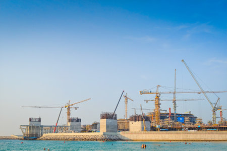 12 03 2025 - Dubai, UAE. The island by Wasl construction site, Dubai Jumeirah beach. Emerging coastal infrastructure and artificial island developmentのeditorial素材