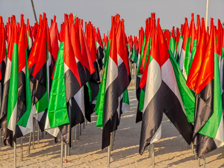 Thousands of UAE flags planted in the sand at Jumeirah Beach forming a vibrant patriotic display. National day attributeのeditorial素材