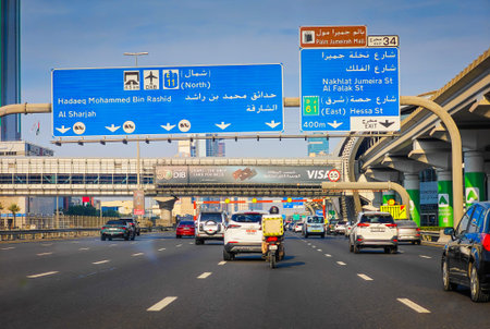 12 03 2025 - Dubai, UAE. Busy Dubai highway with traffic and skyscrapers in the background, modern...