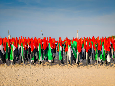 Thousands of UAE flags planted in the sand at Jumeirah Beach forming a vibrant patriotic display. National day attributeのeditorial素材