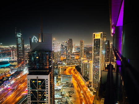 01 11 2026 - Dubai, UAE. Night aerial view of Dubai Business Bay skyline, drone photography capturing illuminated skyscrapers and modern city panoramaのeditorial素材
