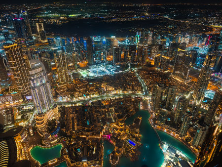 01 11 2026 - Dubai, UAE. Dubai fountain next to Burj Khalifa at Business bay in Dubai downtown. Live show at night with illuminated skyscrapers aroundのeditorial素材