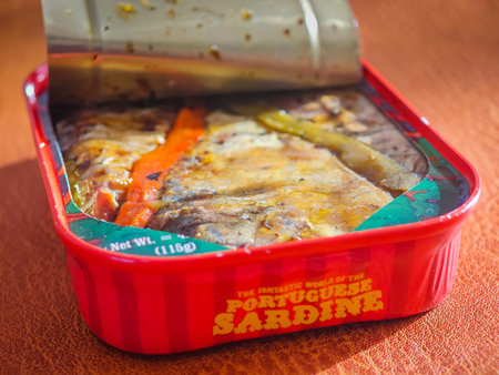 02 18 2026 - Libson, Portugal. Sardines in a can. Colorful can with sardines with pepper in oil. Canned sprats close up photo. Healthy meal concept.のeditorial素材