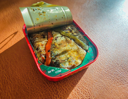02 18 2026 - Libson, Portugal. Sardines in a can. Colorful can with sardines with pepper in oil. Canned sprats close up photo. Healthy meal concept.のeditorial素材