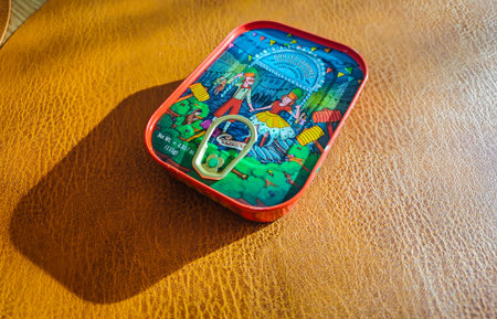 02 18 2026 - Libson, Portugal. Sardines in a can. Colorful can with sardines with pepper in oil. Canned sprats close up photo. Healthy meal concept.のeditorial素材