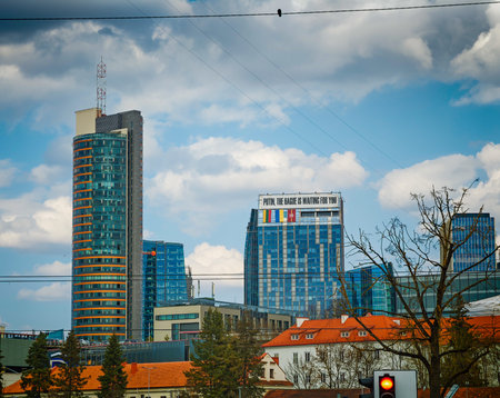 03 30 2026 - Vilnius, Lithuania. Protest sign Putin, the Hague is waiting for You on Vilnius City Municipality building, political message, activismのeditorial素材