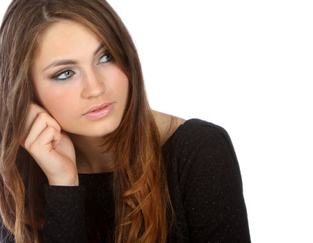 Portrait of a young woman against white background 