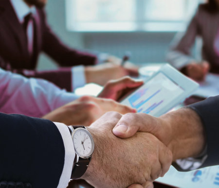 Business people shaking hands, finishing up a meeting.