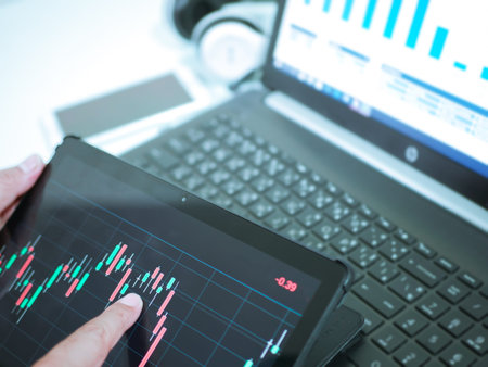 Businessman checking stock market dataà¸¡Stock Market Application for Mobile, Analyzing Data...