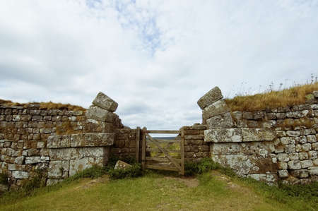 Hadrians wall built by the legionaries of the Roman Emperor Hadrian separating England and Scotlandの写真素材