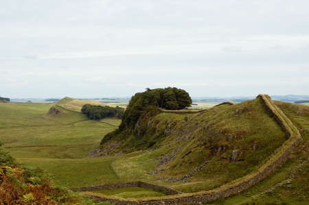 Hadrians wall built by the legionaries of the Roman Emperor Hadrian separating England and Scotlandの写真素材