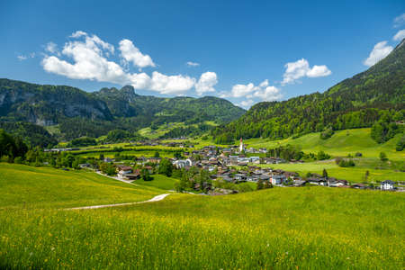 Idyllic village of Unken in summer, blooming meadow and blue sky, Pinzgau, Salzburger Land, Austria, Europeの写真素材