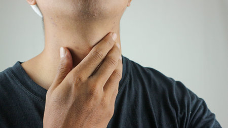 Close-up Of A Man's Hand Touching Her Sore Throat