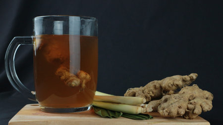 wedang jahe or ginger drink is traditional drink from Indonesia. Dark background
