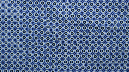Geometric ethnic pattern made with straw in black and white. knitting fabric pattern for background