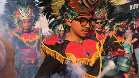 Street dancing parade of colorful mask and costume during the celebration of Indonesian independence day Festival at Ambarawa, Indonesia 20 August 2023のeditorial素材
