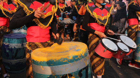 Music band playing drums in the street at public event. Drummers musicians playing music at Indonesian Independence Day festival.のeditorial素材