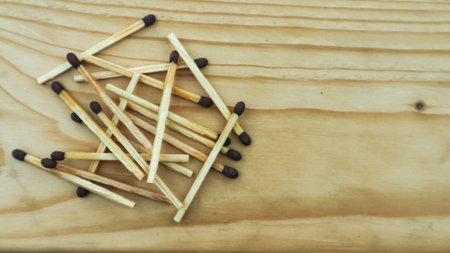 Wooden match sticks isolated on wooden table.の写真素材