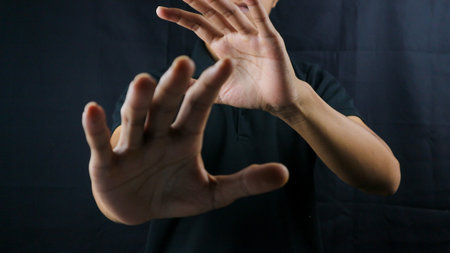 Refusal gesture hands on black background. refused to be invited. rejection. refuse business.