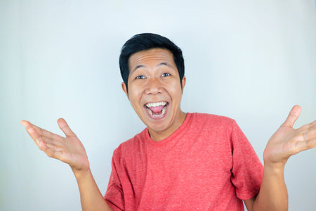 Surprised shocked face asian man isolated on white background for advertisement.
