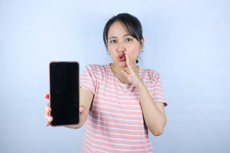 Beautiful Asian woman gesturing with a smartphone