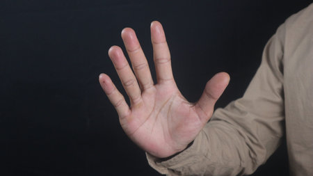 business man hand with five fingers count gesture, isolated on black background