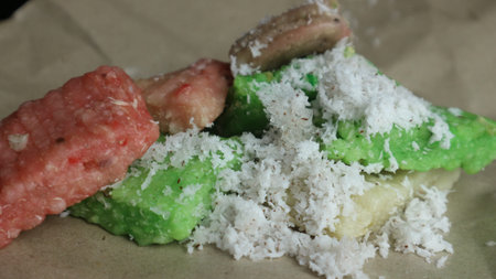 Indonesian cassava getuk cake topped with grated coconut.