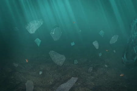 Plastic submerged in the sea. Ocean pollution concept with pieces of plastic bags and litter drowning in the water down the bottomの写真素材