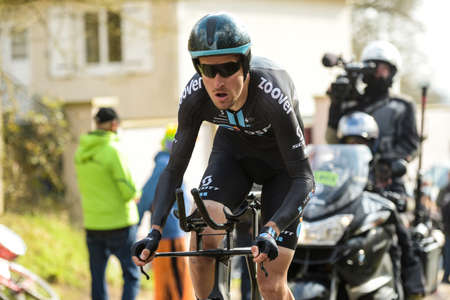 GIEN - FRANCE - 9 MARCH 2021: photography taken on a public street of Andre Greipel during the race paris nice and the time trial of gienのeditorial素材