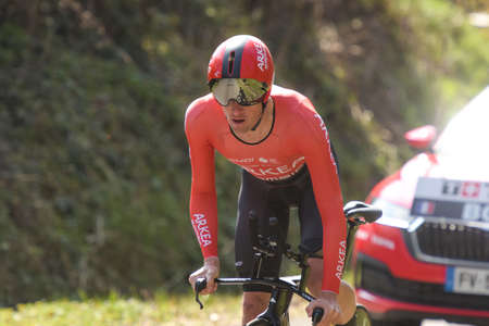 GIEN - FRANCE - 9 MARCH 2021: photography taken on a public street of maxime bouet during the race paris nice and the time trial of gienのeditorial素材