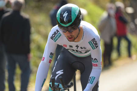 GIEN - FRANCE - 9 MARCH 2021: photography taken on a public street of maximilian schachmann in the race paris nice and the time trial of gienのeditorial素材