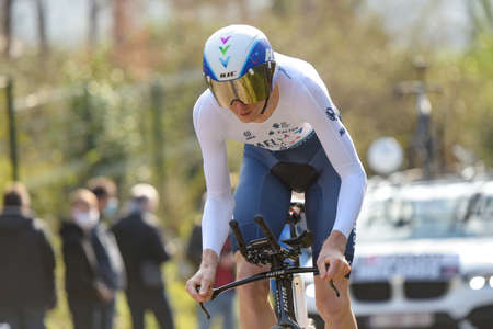 GIEN - FRANCE - 9 MARCH 2021: photography taken on a public street of krists neilands in the race paris nice and the time trial of gienのeditorial素材