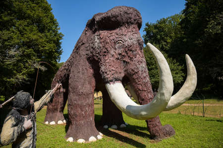 CARDOLAND - FRANCE - AUGUST 2021: statue of mamouth taken on the park of cardoland in the morvan in franceのeditorial素材