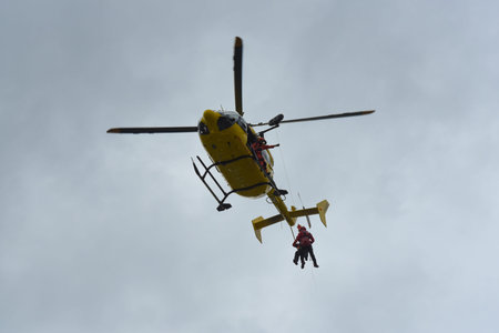 firefighters evacuating a casualty by helicopter during a training in france
