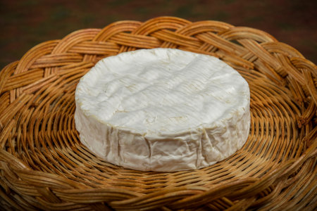 view on a coulommiers cheese on a wicker basketの写真素材