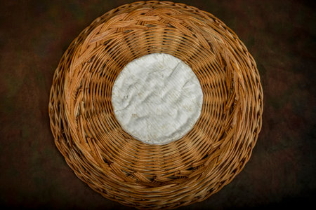 view on a coulommiers cheese on a wicker basketの写真素材