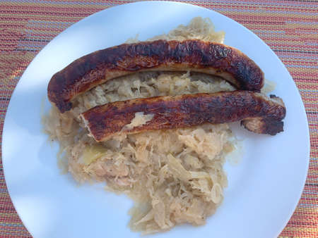 Two Franconian sausages on cabbageの写真素材
