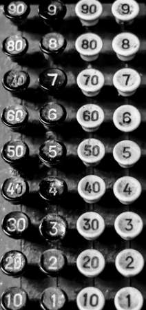 antique calculator in the bankの写真素材