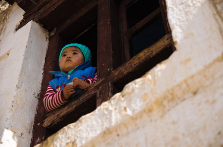 North India little girl looking out at the windowのeditorial素材