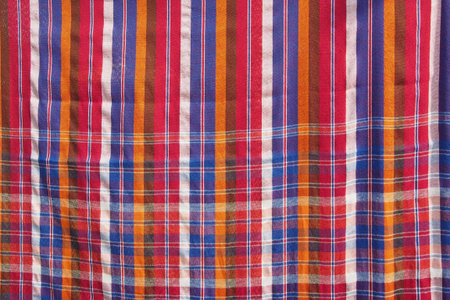 colorful cotton textile in red , white , orange and blue tone from the local art and craft Thailand