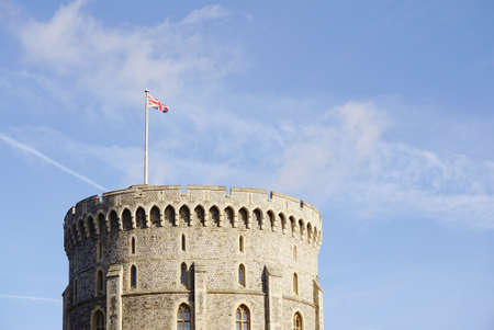 Union Jack flag on the top of England castle with blue skyのeditorial素材