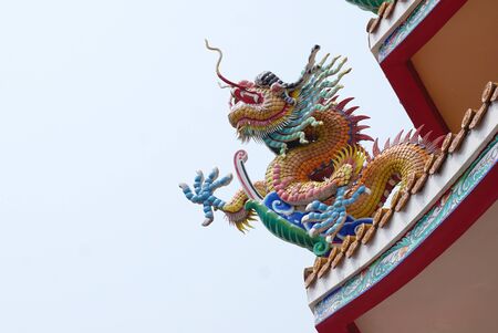 Colorful Chinese dragon sculpture decoration with small ceramic tile in Chinese temple in Thailandの写真素材