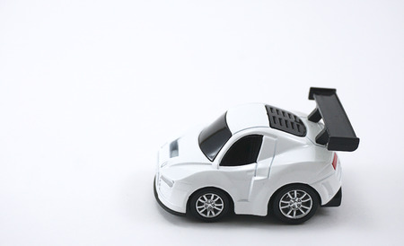 Isolated image of the white color toy car with black wheelsの写真素材