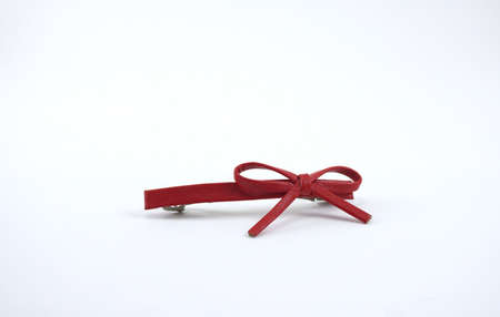 Isolate image of the red color bow hair piece made from synthetic leatherの写真素材